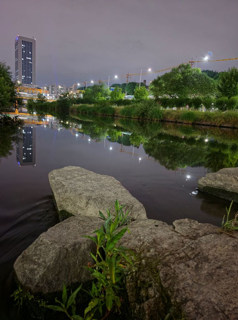 Quiet riverside view at night after a slow 8 km run.
