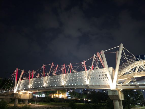 Bridge lights I noticed while slowing down during an evening run.
